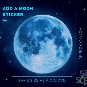 May include: A blue moon sticker, approximately 5 inches in diameter, with the text "ADD A MOON STICKER" and "SAME SIZE AS A CD/DVD". The sticker is on a dark blue background with white stars.