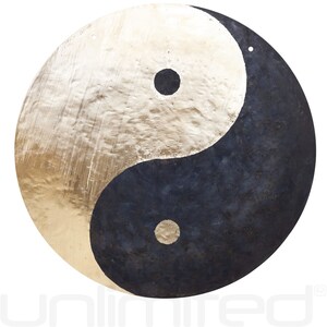 May include: A large, round gong with a yin yang design. The yin side is gold and the yang side is black. The gong has a small hole at the top for hanging.