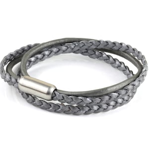 May include: A gray braided leather bracelet with a silver metal clasp.