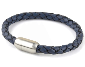 May include: A blue leather bracelet with a silver magnetic clasp.
