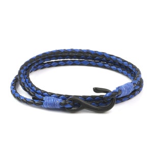 May include: A blue and black braided leather bracelet with a black hook clasp.