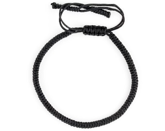 May include: A black braided cord bracelet with a knotted closure.