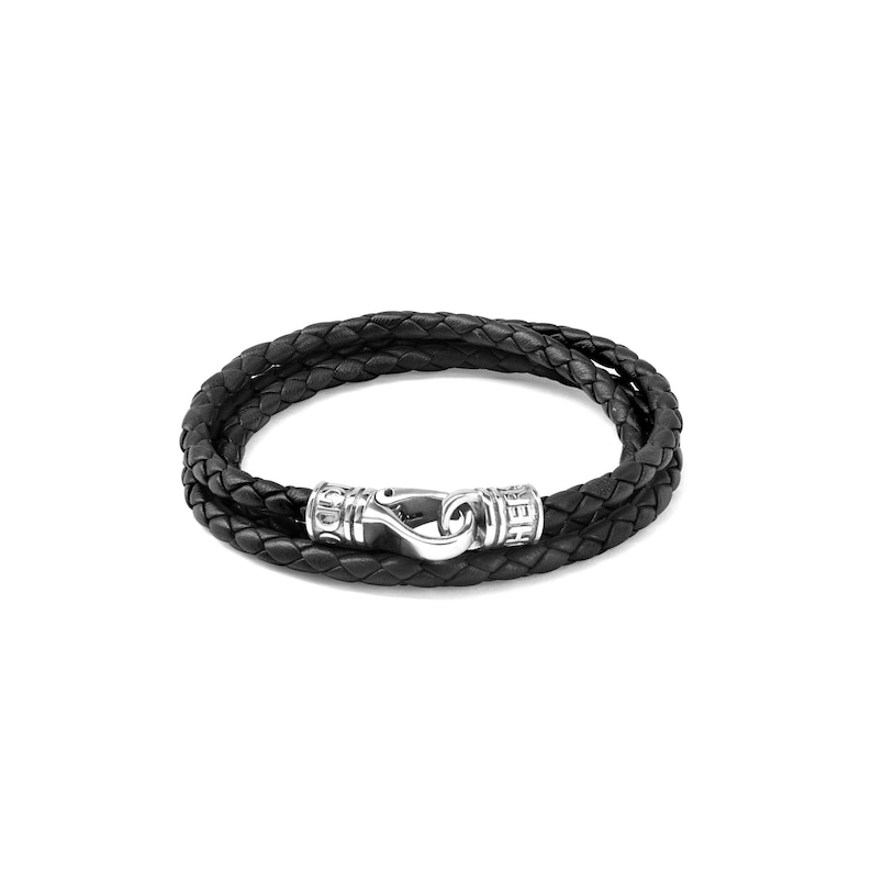 May include: A black leather bracelet with a silver clasp and braided leather design.