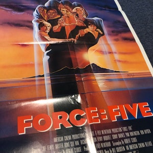 May include: A vintage movie poster for "Force: Five" featuring a stylized fist with a group of people inside. The title "FORCE: FIVE" is in large red letters. The poster has a dramatic sky background with text at the top.