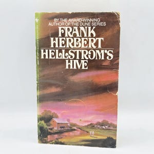 May include: A vintage paperback book titled "Hellstrom's Hive" by Frank Herbert, author of the Dune series. The cover features a landscape painting with a sunset sky, a river, and a building. The book is in good condition.