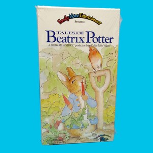 May include: A VHS tape of "Tales of Beatrix Potter" featuring a watercolor illustration of Peter Rabbit holding a carrot. The tape is in its original packaging, with the Family Home Entertainment logo.