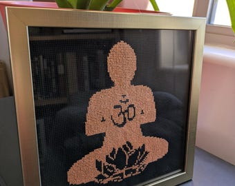 Handmade cross stitch picture. Zen vibes, Buddha in meditation, peaceful image, orange and black.