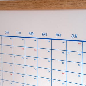 May include: A white calendar with blue grid lines and red text. The months of January, February, March, April, May, and June are listed across the top. The days of the week are listed down the left side. The numbers 10, 19, 23 are visible.