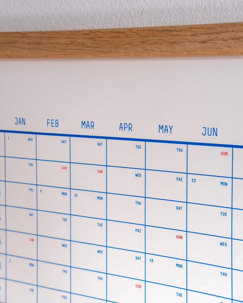 May include: A white calendar with blue grid lines and red text. The months of January, February, March, April, May, and June are listed across the top. The days of the week are listed down the left side. The numbers 10, 19, 23 are visible.
