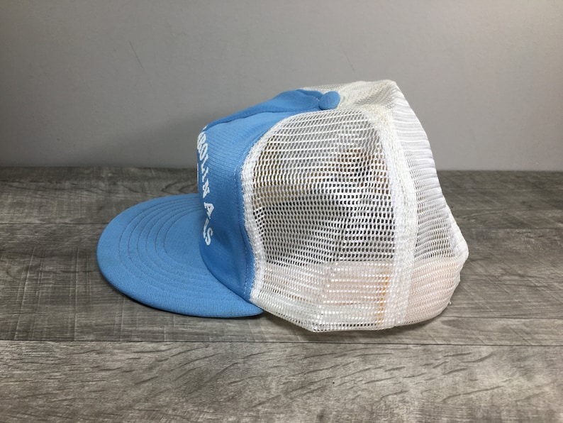 May include: A light blue and white mesh trucker hat with the text "GO AWAY" embroidered on the front.