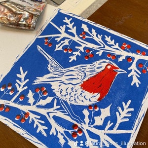 Festive Robin hand printed lino cut on folded card with envelope