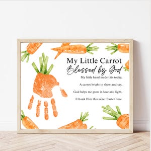 May include: A framed print with the text "My Little Carrot Blessed by God" and a handprint in orange paint. The print features watercolor carrots and a poem about Easter.