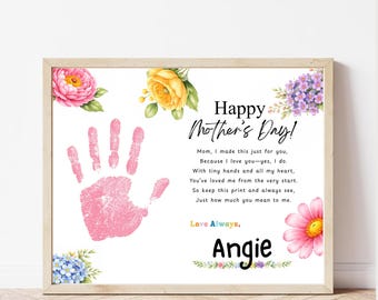 May include: A framed print for Mother's Day featuring a pink handprint, floral decorations, and the text "Happy Mother's Day!" and a poem. The print includes the name "Angie" and is in a wooden frame.