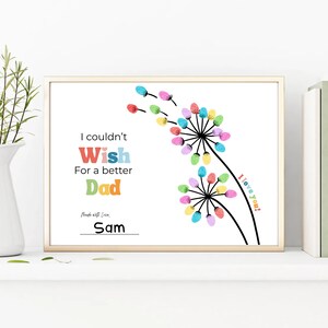 May include: A framed print with the text "I couldn't Wish For a better Dad". The artwork features colorful finger-painted flowers and the words "I love you!" and "Made with Love, Sam".
