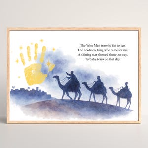 May include: A framed print featuring a watercolor illustration of the Three Wise Men on camels, silhouetted against a blue and purple sky. A yellow handprint and text are also included. The text reads: "The Wise Men traveled far to see..."