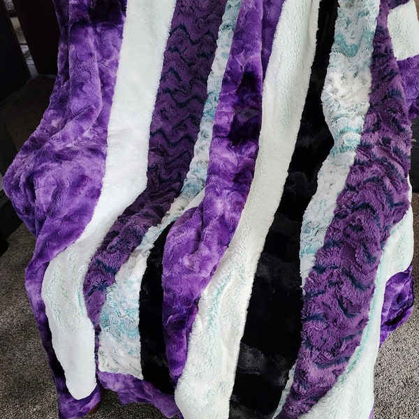 Purple minky strip quilt, weighty layers of Shannon Lux Cuddles with drops of teal, frosted teal, black and purple blends, luxurious throw