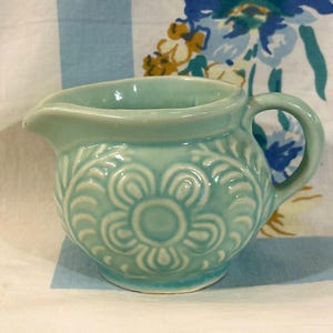 Shawnee pottery creamer, Flower and fern, Aqua blue, 1950s