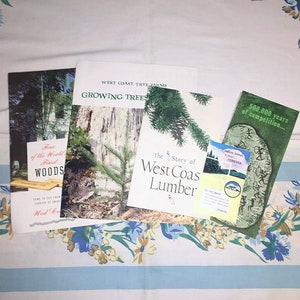 May include: A collection of brochures and pamphlets about West Coast Tree Farms, featuring images of trees and the text "Growing Trees", "The Story of West Coast Lumber", "500,000 years of competition...", and "Trees of the World Found in our Woods".