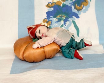 Pin cushion, Asian child on Pumpkin pin cushion, Sleeping Asian Child Pin cushion, 1950s