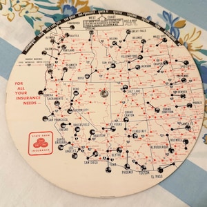 May include: A vintage map of the United States, featuring major cities and highways in red and black. The map is circular, with text including "State Farm Insurance" and "For All Your Insurance Needs."