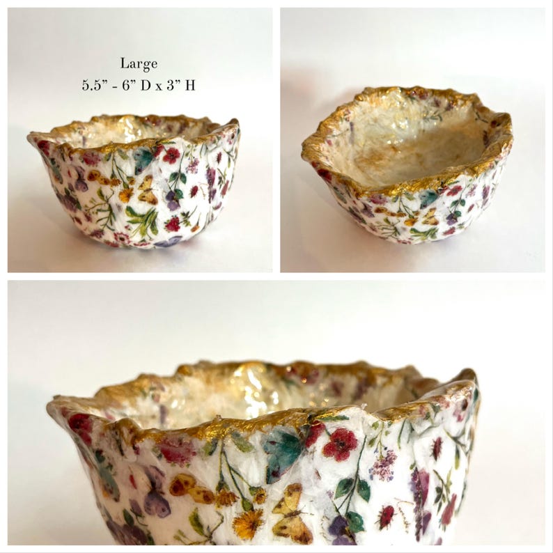 Pode incluir: Uma tigela decorativa com um padr&atilde;o floral e de borboletas. A tigela tem uma borda dourada e mede 14-15 cm de di&acirc;metro e 7,6 cm de altura. A tigela &eacute; branca com flores e borboletas coloridas.