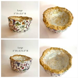 Pode incluir: Duas tigelas decorativas com padr&otilde;es florais e bordas douradas. As tigelas s&atilde;o rotuladas como "Large" e medem 12,7 cm de di&acirc;metro e 6,35 a 7,62 cm de altura. As tigelas t&ecirc;m um interior branco.
