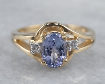 Anillo de oro amarillo de 14 quilates con tanzanita y diamantes, tres piedras