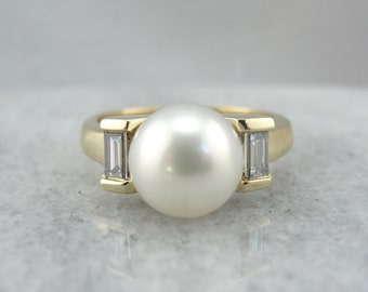 Sleek Modernist Pearl and Baguette Cocktail Ring W5E2CN-D