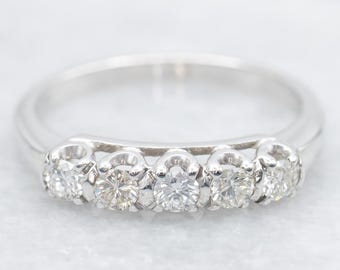 14 kt witgouden trouwring met vijf diamanten, stapelring