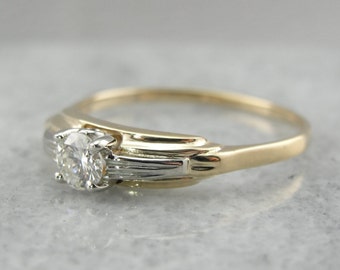 May include: A vintage engagement ring with a single round diamond set in a yellow gold band with a white gold accent.
