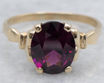 Anillo solitario de oro y granate rodolita de la década de 1940