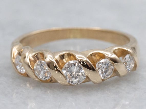 Twisting Gold Graduated Diamond Band