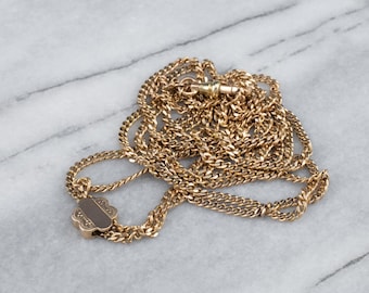 Cadena de reloj victoriana antigua de oro de 14 quilates, con cierre floral deslizante, tipo lazo de 32 pulgadas.