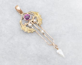 May include: A gold pendant with a pink gemstone and pearl accents. The pendant is in the Art Nouveau style and features a delicate design of leaves and stems.
