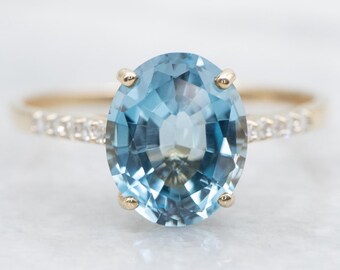 Anello con topazio blu di Londra e diamanti, oro giallo 10 carati, taglio ovale