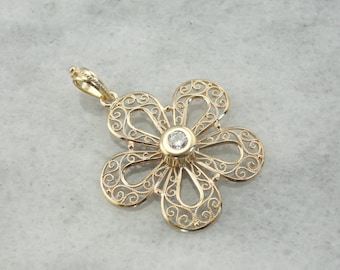 Filigree Surrounding a Sparkling Center Diamond Floral Pendant JA6JM4