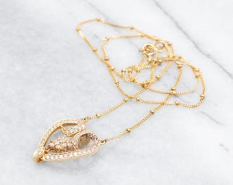 Halsband i 14 karat gult guld med diamanter och hjärtformad kedja, 45 cm