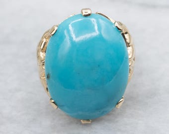 Oval Cut Turquoise Cabochon in Vintage Gold Setting