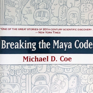 May include: Book cover with a white background and a blue and white pattern of Mayan glyphs. The title "Breaking the Maya Code" is in white text on a blue background. The author's name, "Michael D. Coe", is in red text on a white background. The quote "One of the great stories of 20th-century scientific discovery. - New York Times" is in black text on a red background.