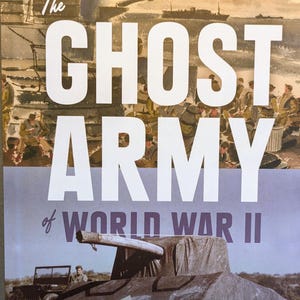 May include: Book cover for "The Ghost Army of World War II" by Rick Beyer and Elizabeth Sayles. The cover features a tank, soldiers, and the title in large white letters. The book details how a unit deceived the enemy with inflatable tanks and sound effects.