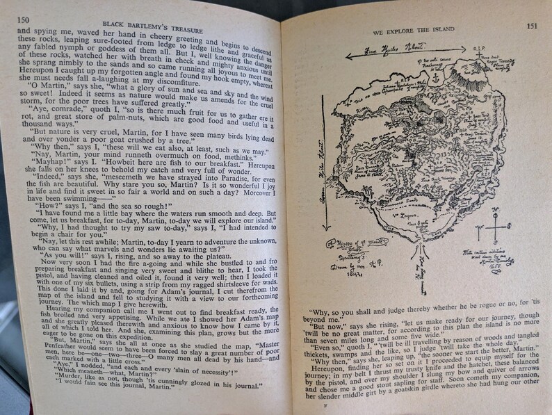 May include: Open book pages with text and a detailed, hand-drawn map of an island. The map includes geographical features, compass directions, and handwritten annotations, suggesting exploration and adventure.