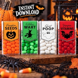 May include: Four clear rectangular containers filled with orange, green, white, and red sweets. Labels read Pumpkin SEEDS, Witches WART, Ghost POOP, and Vampire VITAMINS with corresponding black icons of a jack-o'-lantern, witch, ghost, and bat.