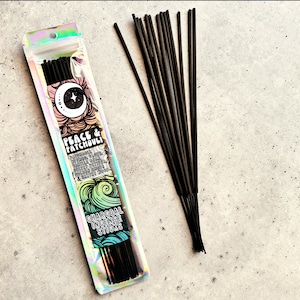 May include: A pack of black charcoal incense sticks with a holographic label that reads "Peace & Patchouli" with a list of ingredients including sandalwood, clove, vanilla, patchouli, amber, and frankincense.