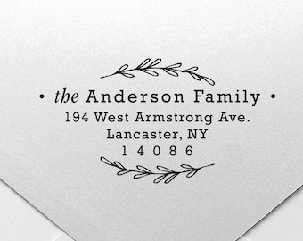 May include: A white envelope with a black return address stamp that reads "• the Anderson Family • 194 West Armstrong Ave. Lancaster, NY 14086".
