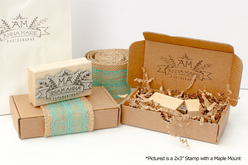 Custom rubber stamp for logos and branding. Wood mounted with laser engraved image on top. Pictured is a 2x3 inch stamp