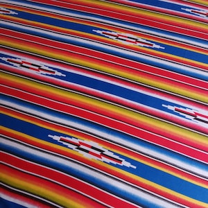 May include: A colorful striped fabric with a repeating geometric pattern. The fabric is red, blue, yellow, white, and black.