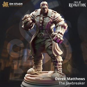 May include: A detailed miniature figure of a man with a mechanical arm and a coat, standing on a circular base. The figure is painted in a muted brown and grey colour scheme. The text "Derek Matthews The Jawbreaker" is printed below the base.