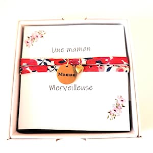 Fancy bracelet with liberty cord and engraved medallion with mom and card you are a wonderful mom. Stainless steel.