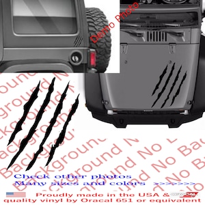 May include: Black vinyl decal of four claw marks on a gray Jeep. The decal is available in various sizes and colors.  Check other photos for more options. Proudly made in the USA & ORACAL quality vinyl by Oracal 651 or equivalent.