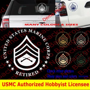 May include: White vinyl decal sticker of the United States Marine Corps logo with the words "United States Marine Corps" and "Retired" in a circle around the logo. The logo features a crossed rifle and a sergeant's chevron. The sticker is shown on a car window.